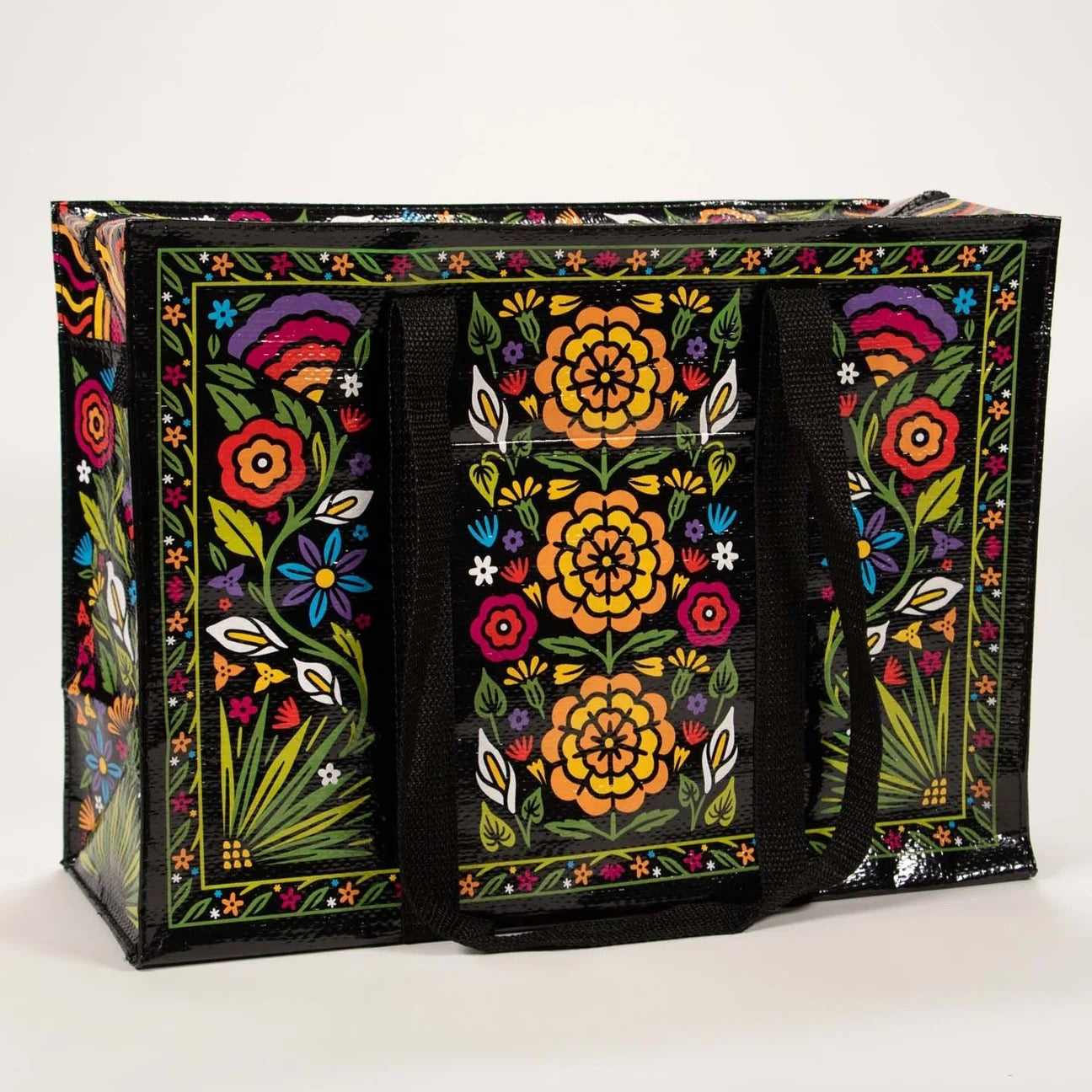 Große schwarze Einkaufstasche mit buntem Blumenmuster und schwarzen Tragegriffen