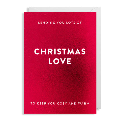 Rote Weihnachtskarte mit weißem Text 'SENDING YOU LOTS OF CHRISTMAS LOVE TO KEEP YOU COZY AND WARM'.