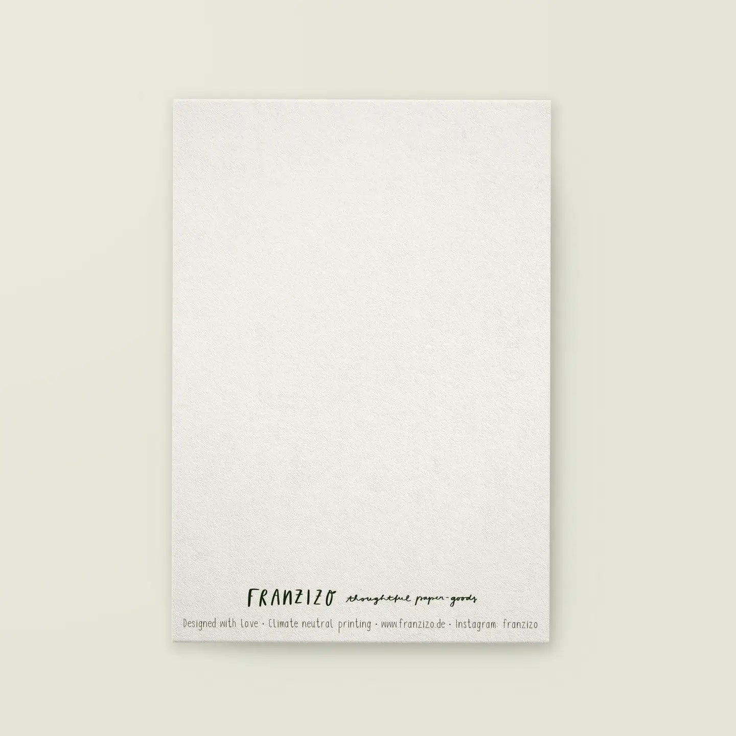 Rückseite der Postkarte weiß mit Aufschrift 'FRANZIZO thoughtful paper goods' und Hinweis auf klimaneutralen Druck