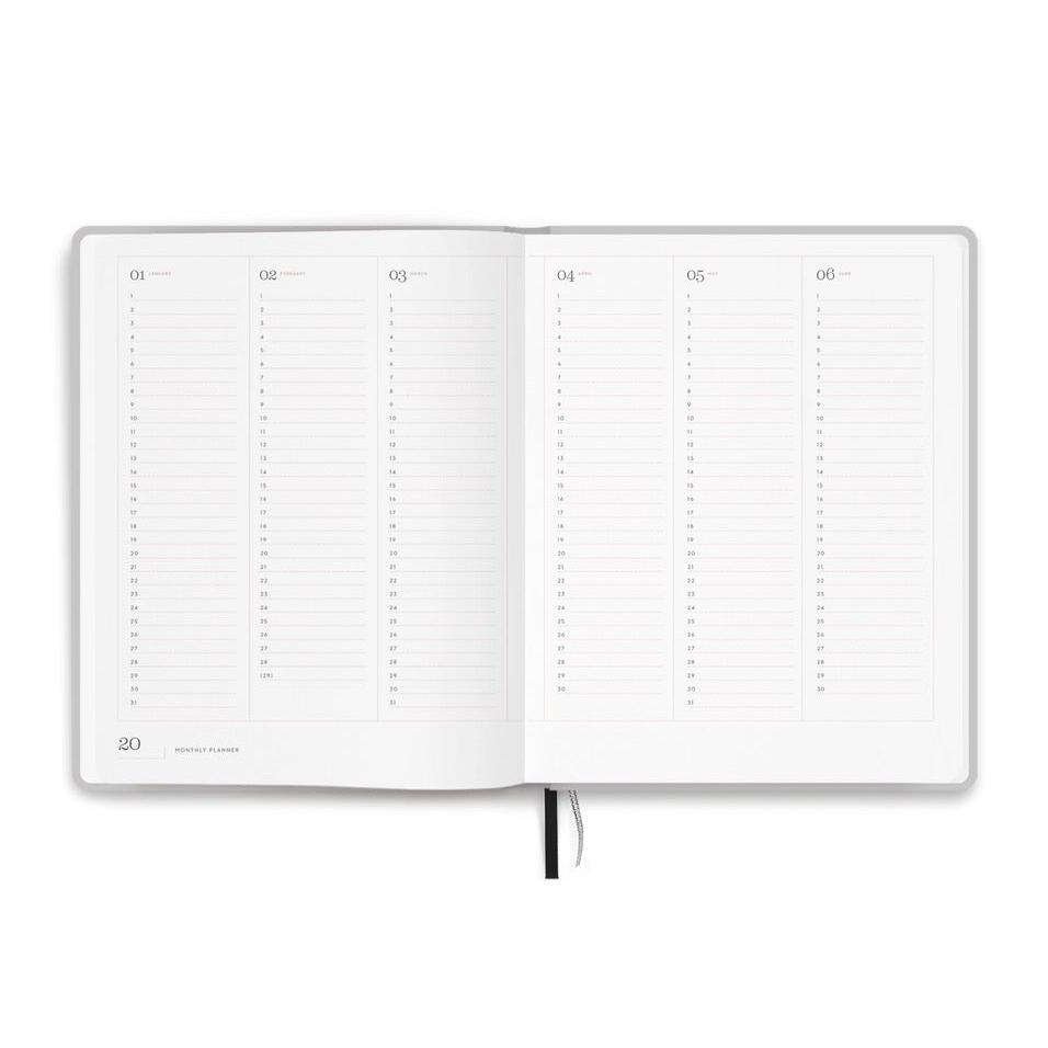 Aufgeschlagener Kalender mit Monatsübersicht, Spalten für Wochentage