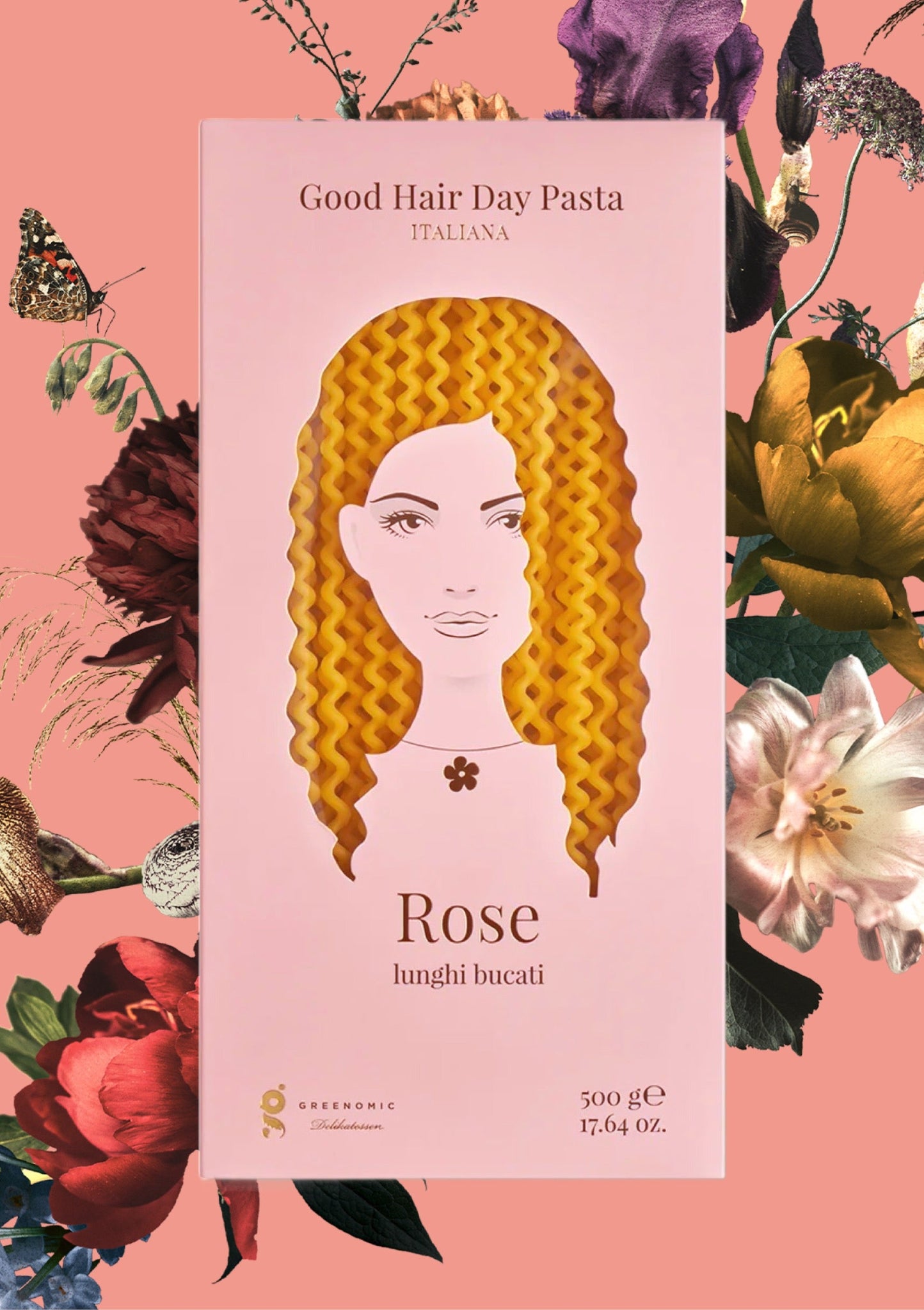 Verpackung von Good Hair Day Pasta mit wellenförmiger Pasta, Produktname 'Rose lunghi bucati', 500 g auf geblümten Hintergrund