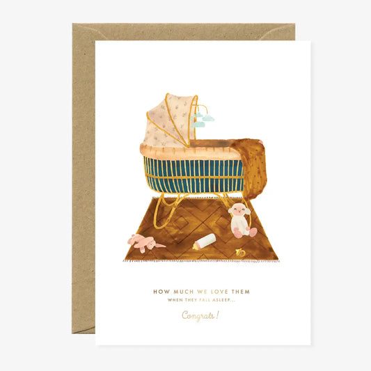 Kinderwagen mit Decke, Spielzeug und Babyflasche auf Teppich, Text 'How much we love them when they fall asleep... Congrats!'