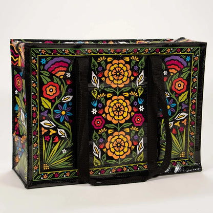 Große schwarze Einkaufstasche mit buntem Blumenmuster und schwarzen Tragegriffen