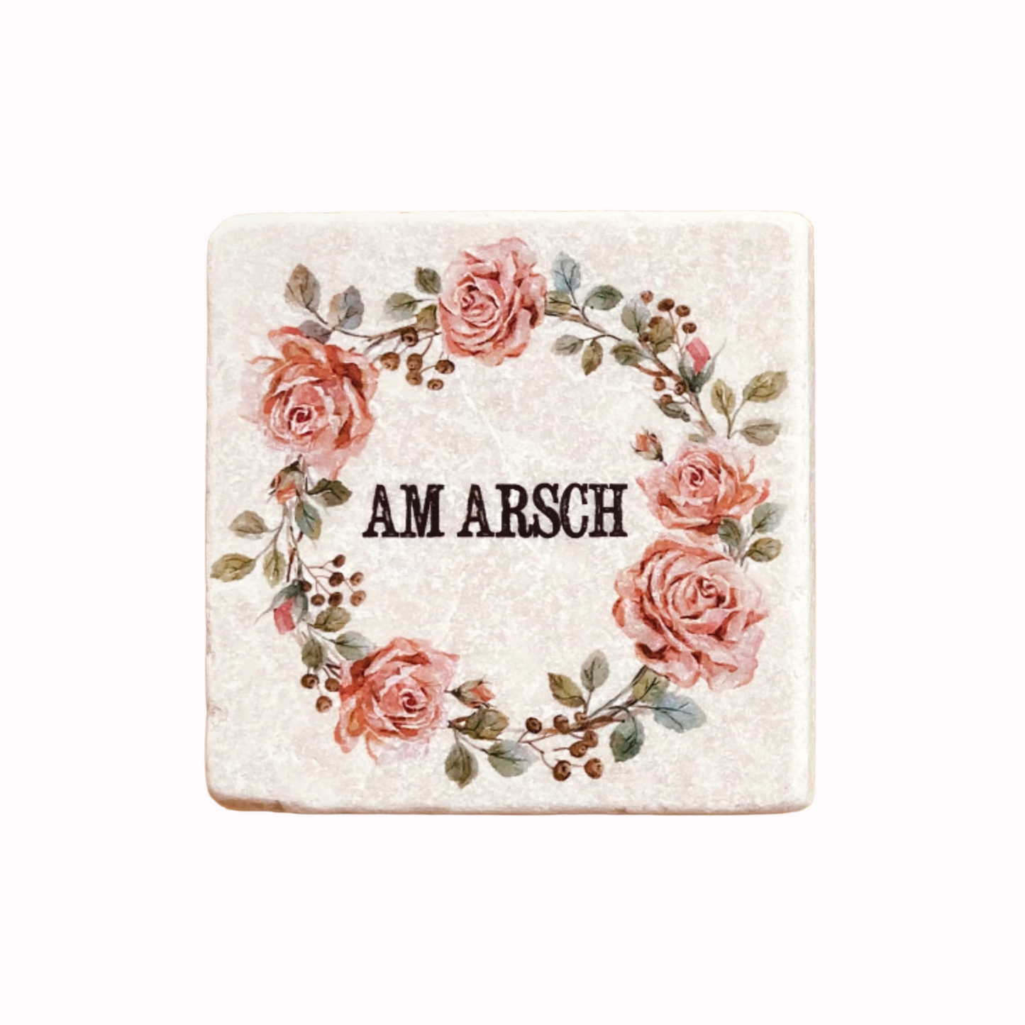 Quadratische Fliese mit Rosenkranz und dem Schriftzug 'AM ARSCH' in der Mitte