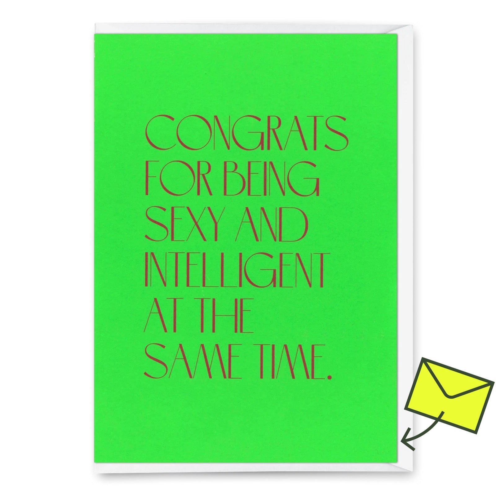 Eine Glückwunschkarte mit hellgrünem Hintergrund und dunklem Text mit der Aufschrift „Congrats for being sexy and intelligent“. In der oberen rechten Ecke befindet sich ein gelber „Deli Cards“-Aufkleber.