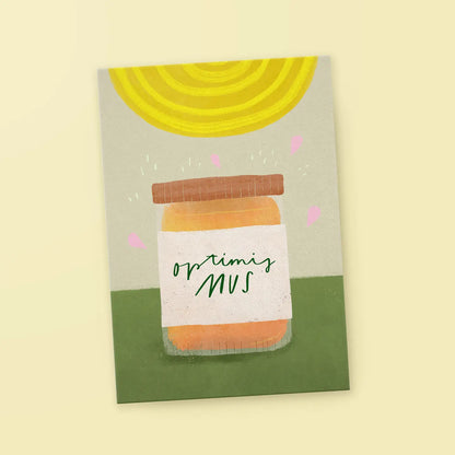 Illustration eines Glases mit braunem Deckel und Etikett mit der Aufschrift 'optimismus', darüber stilisierte gelbe Sonnenstrahlen