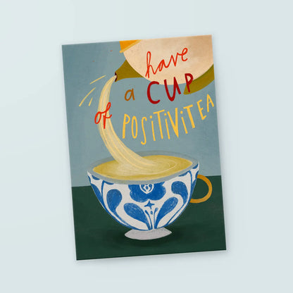 Illustration einer Teetasse mit blauem Muster, aus der Tee eingeschenkt wird, mit dem Text 'have a cup of positivitea'