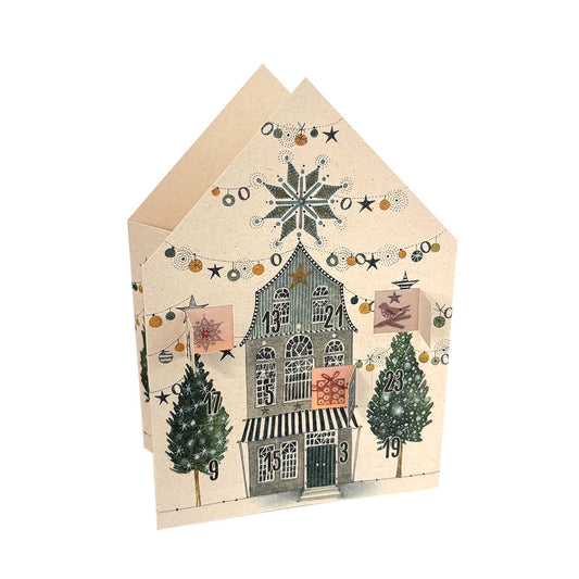 Edition Gollong leuchtendes Adventskalender-Haus mit der Illustration eines winterlichen Stadthauses im skandinavischen Stil und Sternengirlanden.