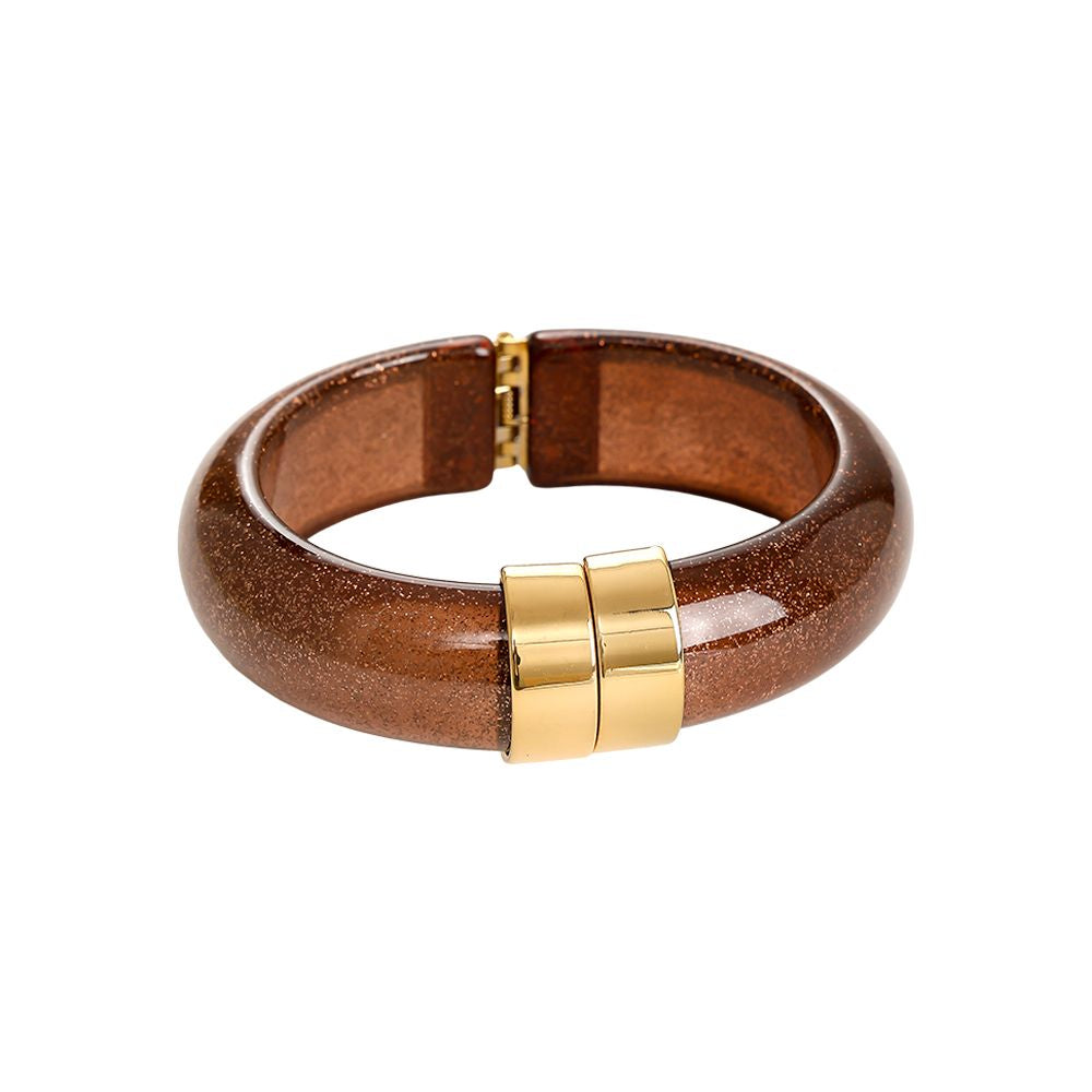 Brauner Armreif mit intensivem Glitzer-Finish und Gold-Applikation.