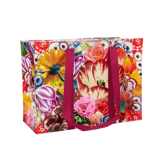 Bunte Einkaufstasche mit Blumenmuster und zwei langen, pinken Tragegriffen