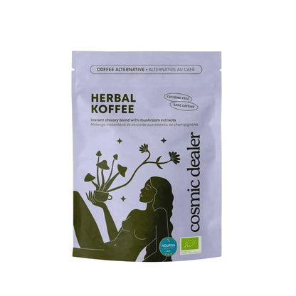 Hellviolette Produktverpackung der Kaffeerealternative „Herbal Koffee“ von Cosmic Dealer vor weißem Hintergrund. Auf der Packung ist eine dunkelgrüne, künstlerische Silhouette einer liegenden Frau zu sehen, die eine Tasse hält, aus der Pilze und Blumen wachsen.