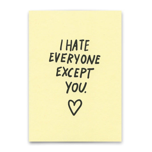 Auf einem hellgelben Hintergrund steht in handschriftlicher, schwarzer Schrift: 'I HATE EVERYONE EXCEPT YOU.' Darunter ist ein einfaches Herzsymbol gezeichnet.