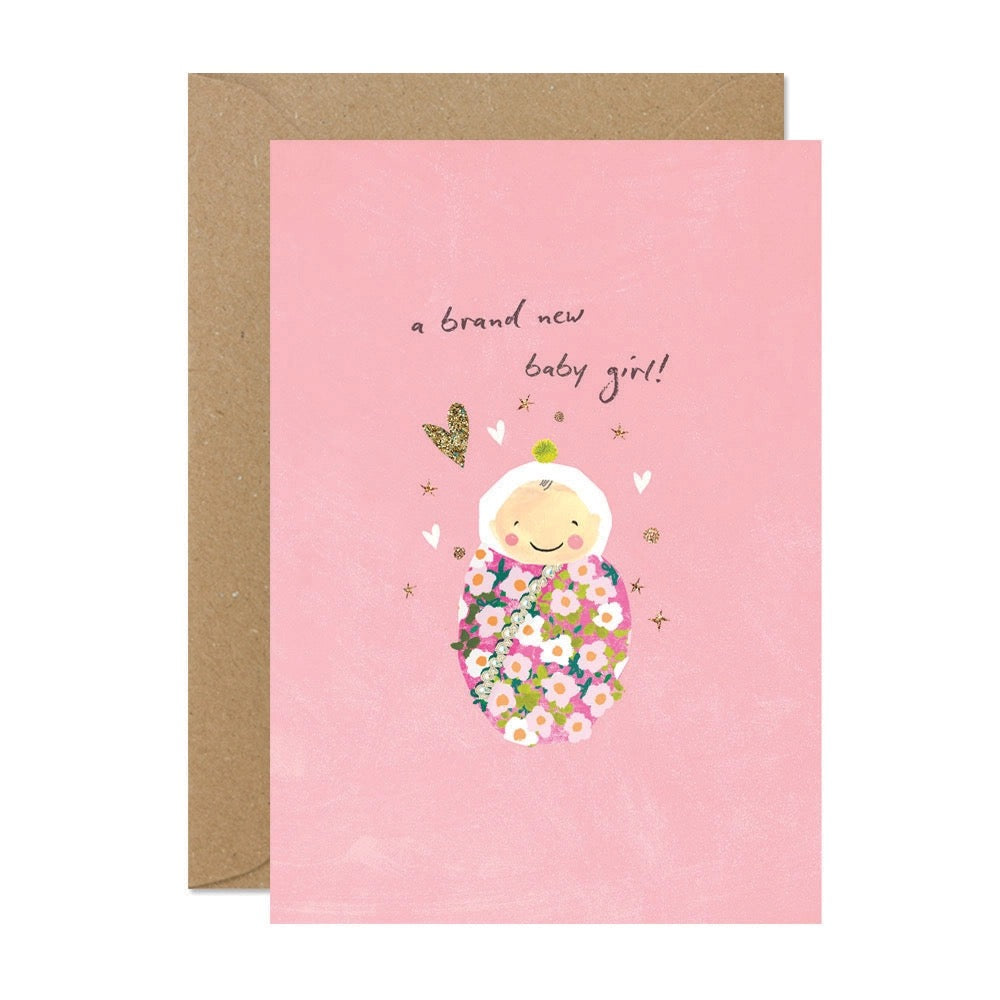 Grußkarte zur Geburt eines Mädchens in Rosa mit Baby in Blumendecke.