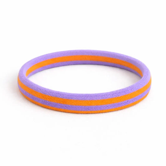 Elastisches Nylon-Haargummi in Lila mit orangefarbenen Streifen, schonend zum Haar.