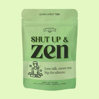 Grüner Teebeutel der Marke Improper Cup mit schwarzer Aufschrift 'SHUT UP & zen' und Slogan 'Less talk, more tea. Sip for silence.'