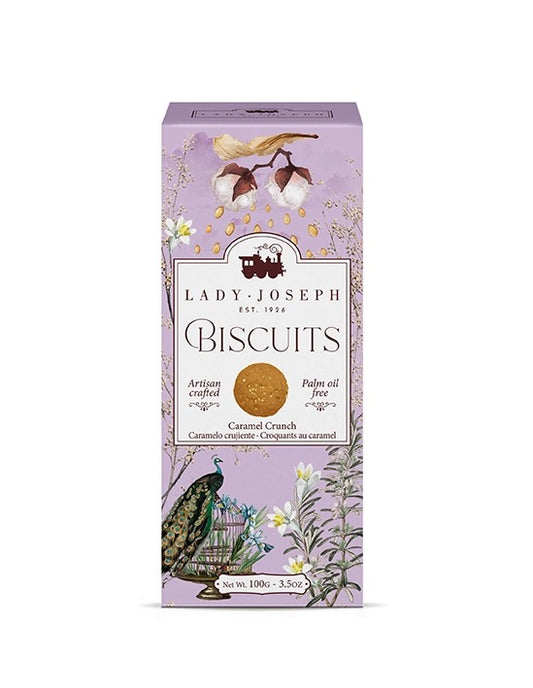 Hellviolette Verpackung mit floralen Illustrationen, einem Pfau und der Aufschrift 'Lady Joseph Biscuits Caramel Crunch'.