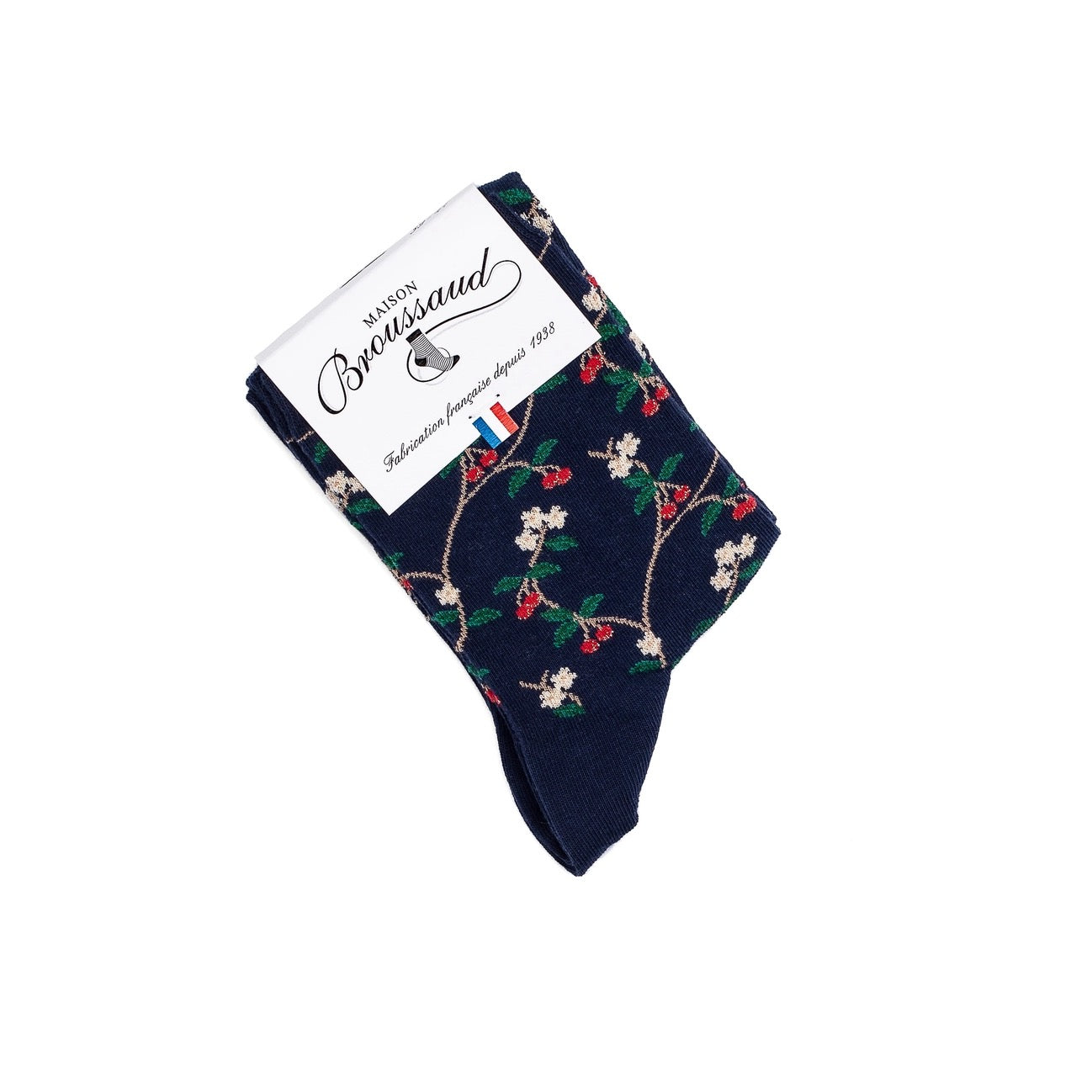 Gefaltete marineblaue Socken von Maison Broussaud mit weißer Banderole, Motiv mit roten Kirschen und weißen Blüten.