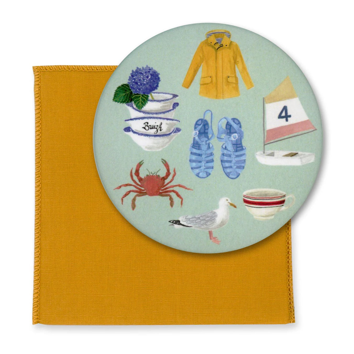 Runder Taschenspiegel mit maritimen Illustrationen: Gelber Regenmantel, blau-weiße Keramikschalen mit Aufschrift "Breizh", eine Krabbe, eine Möwe und ein Segelboot auf hellblauem Grund.