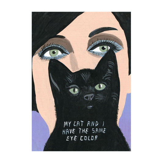 Eine Illustration, die das Gesicht einer Frau und einer schwarzen Katze in enger Komposition zeigt. Beide haben exakt die gleiche hellgrüne Augenfarbe. Über dem unteren Teil des Bildes steht in weißer Handschrift: „MY CAT AND I HAVE THE SAME EYE COLOR“. Der Hintergrund ist in einem schlichten Violett gehalten.