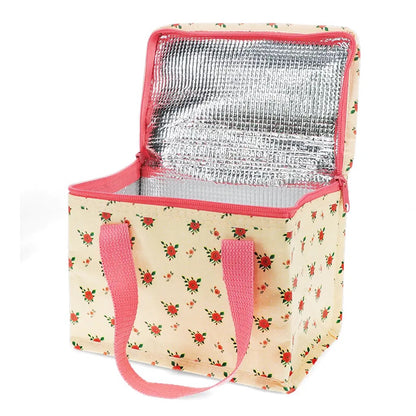 Geöffnete Thermo-Lunchbag von Rex London mit silberner Isolierfolie im Innenraum und rosa Reißverschluss.