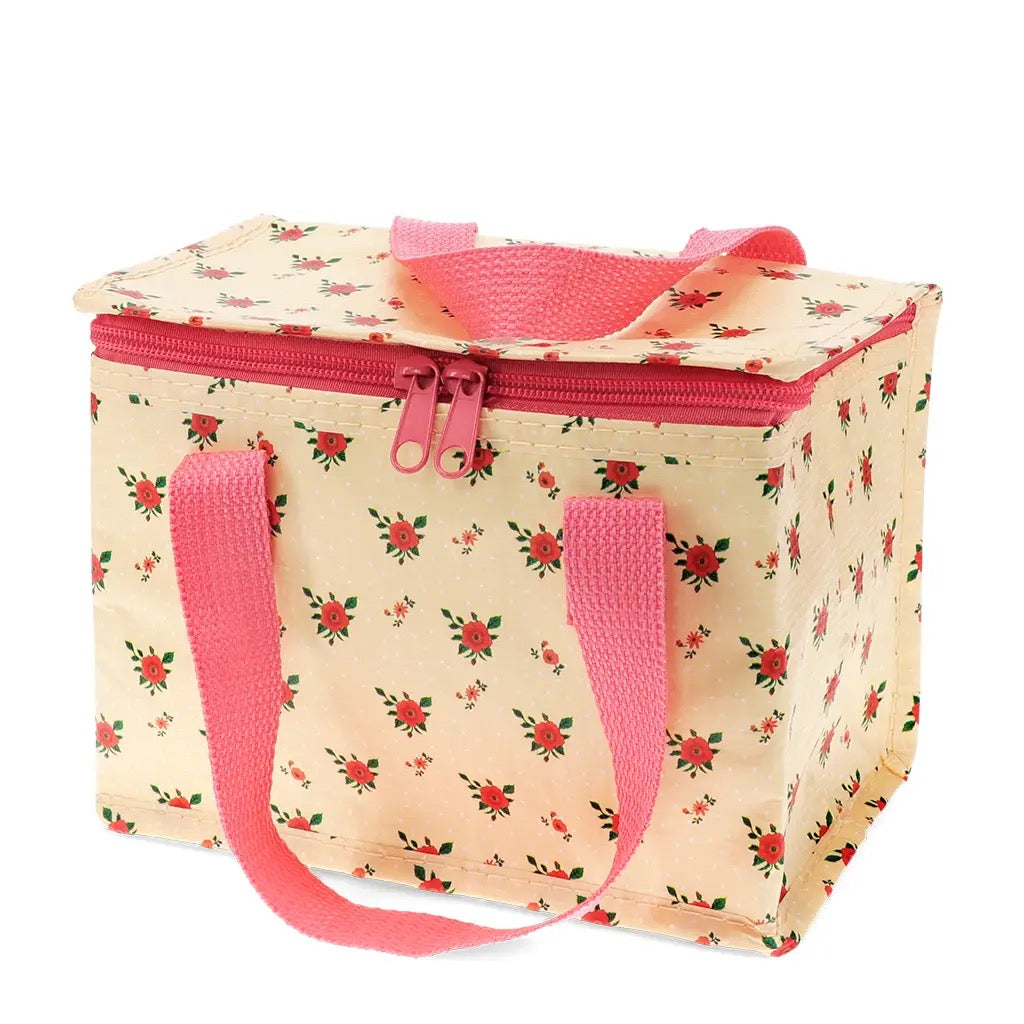 Geschlossene Kühltasche Vintage Rose aus recyceltem Material mit rosa Tragegriffen.