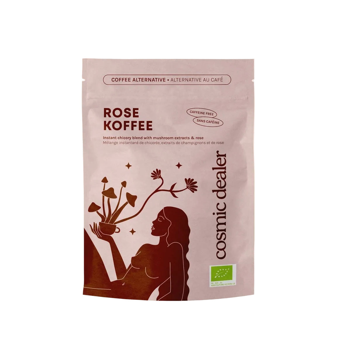 Rosafarbene Verpackung von Cosmic Dealer Rose Koffee, eine koffeinfreie Kaffeealternative mit Chicorée, Pilzextrakten und Rose. Bio-Siegel sichtbar auf minimalistischem Design.